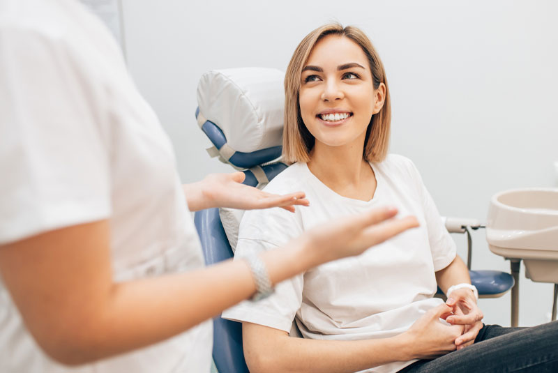 dental patient discussing options after dental emergency