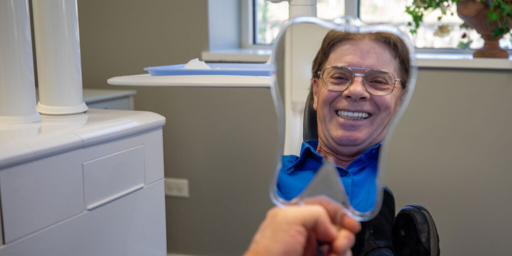 patient smiling after their dental procedure